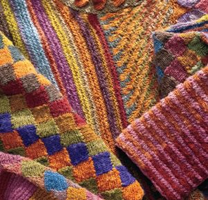 Using the inherent energy of singles yarns, many colors, and a variety of knit stitches as creative tools, Kathryn Alexander creates awe-inspiring artistic garments.
