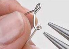 Learn how to make your very own kidney ear wires with this free jewelry making project, step 6 includes bending the wire and filing it for a high shine.