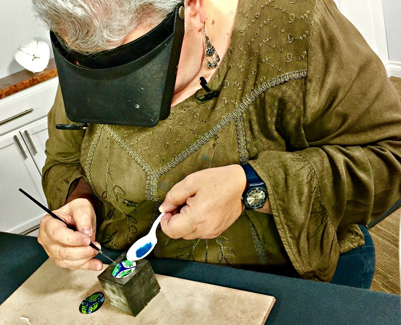 Jackie intensely concentrating in the studio making faux cloisonne jewelry