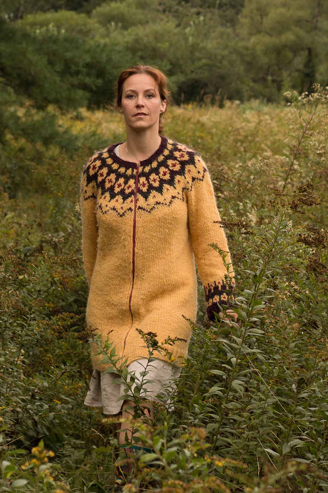 The top-down worked round yoke sweater/-coat, Björt (which means “bright” in Icelandic), is a versatile design that can be knit in either an aran- or bulky-weight yarn, resulting in two very different garments.