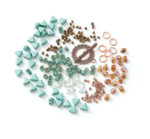 The BeadSmith bracelet challenge kit materials which include Khéops par Puca triangles, SuperDuos, True 2mm fire-polished rounds, size 6° seed beads, two colors of size 11° seed beads, and a copper-plated toggle clasp