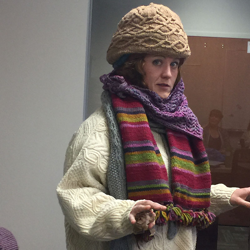 Want to stay cool this summer? Do the opposite of Lisa Shroyer, who wore over a dozen knitted items in our office handknits contest. Photo by Deb Gerish.