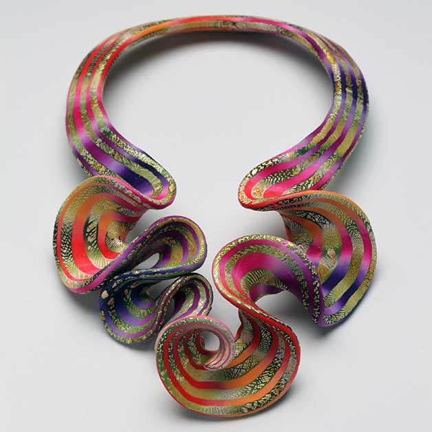 Red Ruffle Cascade Neckpiece, 2009 Polymer and acrylic paint 9 1/4 x 5 1/2 x 3 5/8 inches Racine Art Museum, Gift of Elise Winters and Sherwood Rudin Photo credit: Penina Meisels