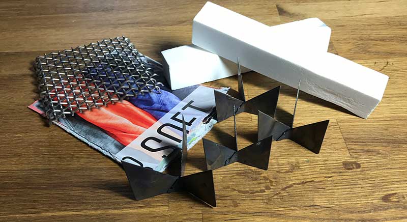 A few enameling extras: heavy-duty firing screen suited for use in a kiln, heavy-weight paper for sifting enamel over, alundum stones, and trivets.