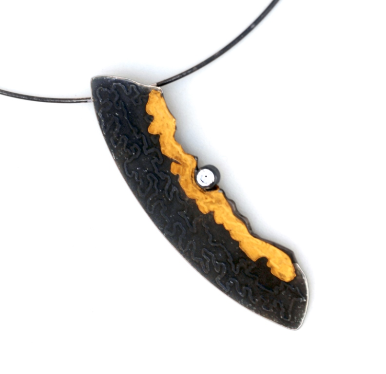 gold fused onto steel jewelry by jewelry artist Bette Barnett