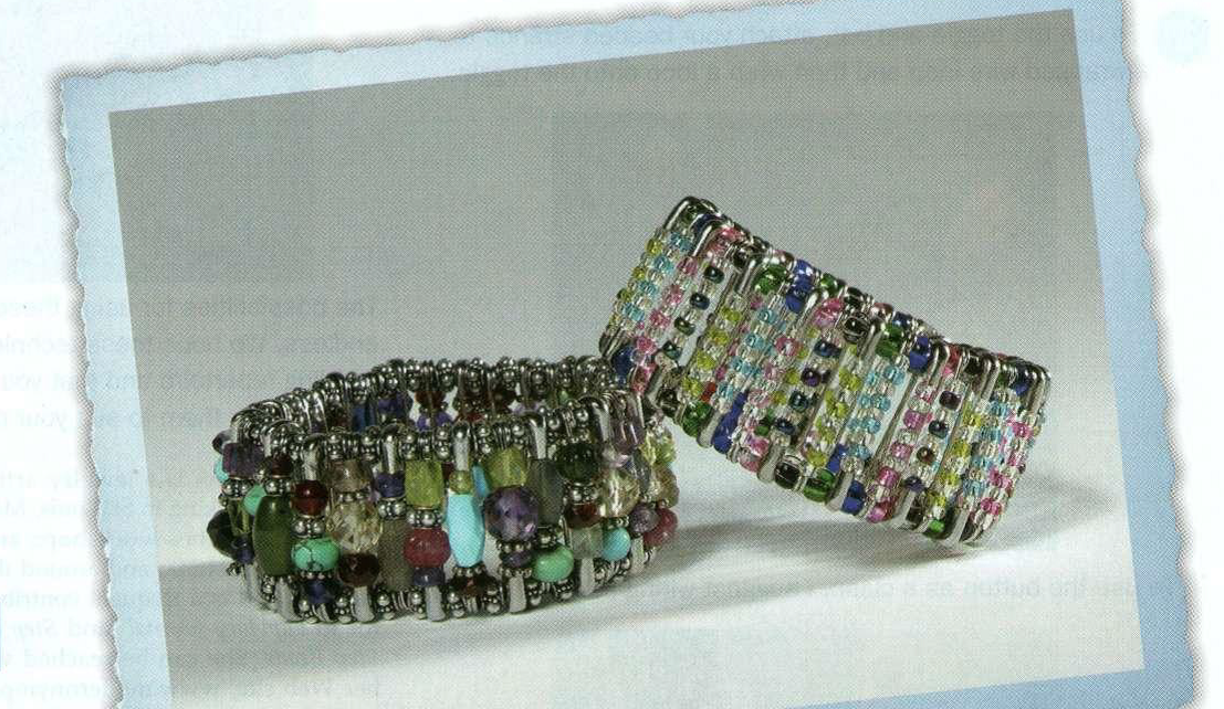 Made with elastic, safety pins, and beads, the cuff on the left by Nina Cooper and the one on the right by her daughter Lyra appeared in Lapidary Journal October 2003.