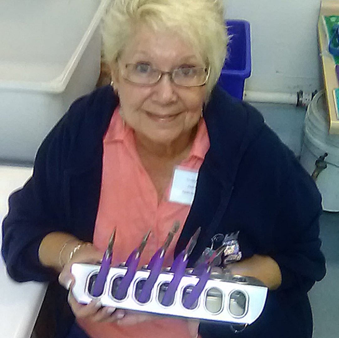 jewelry-making tips: Christy Gorrow demonstrates how she uses a chick feeder to hold pliers.