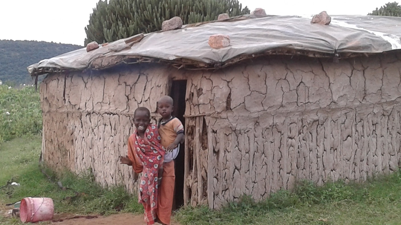 children at hut near gemstone mines